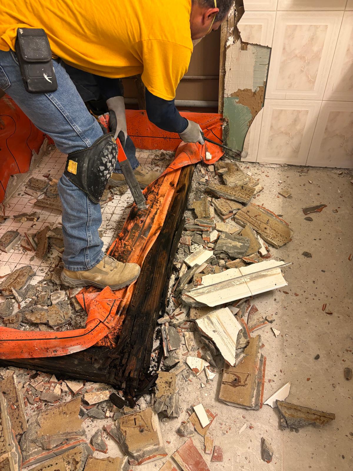 Team removing deteriorated materials